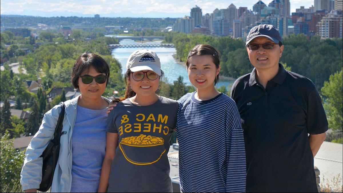 Yang with her parents and younger sister in Calgary.